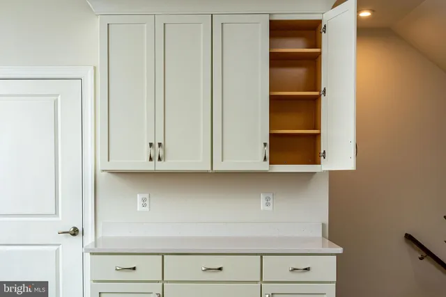 a view of cabinets and window