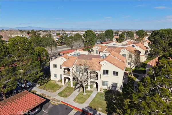 an aerial view of a house with a ocean view