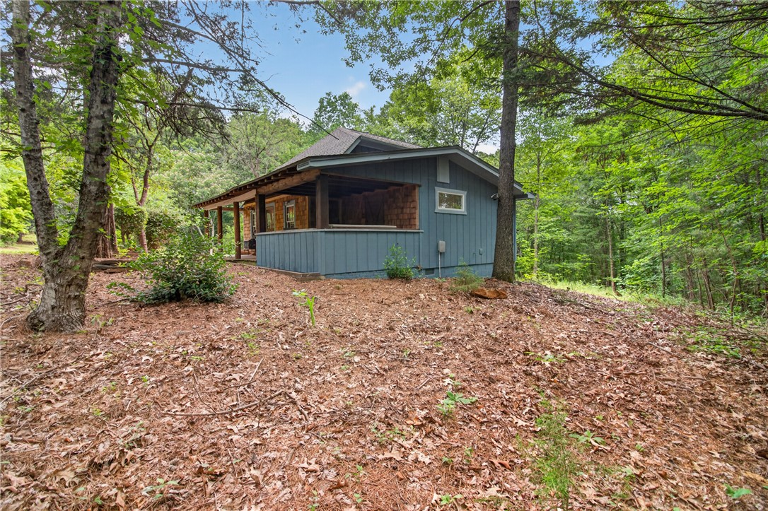 130 Maggie Rufus Lane Westminster, SC 29693 - Photo 5 of 50 A tranquil woodland retreat, this home offers natural privacy and a charming covered porch.