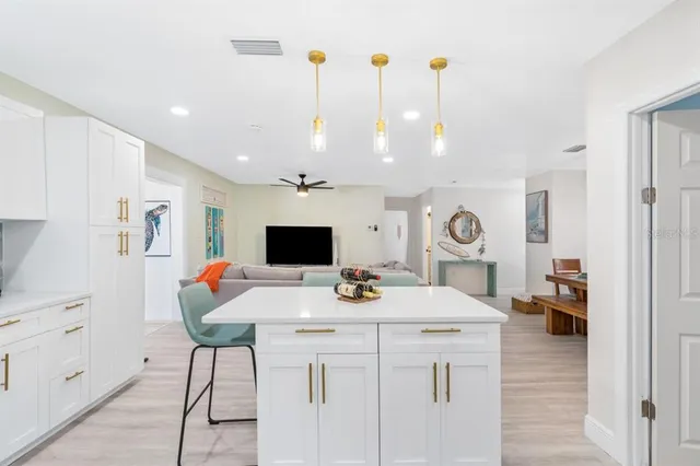 a kitchen with a table chairs and a stove