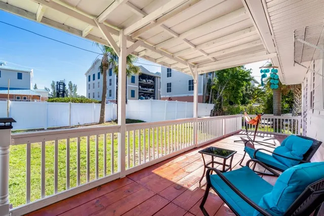 a view of a balcony with furniture