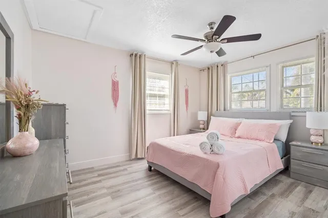 a bedroom with a bed and window