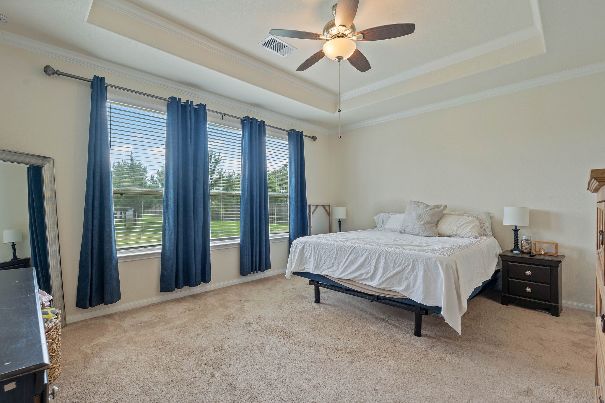 16450 Stonewall Street Conroe, TX 77303 - Photo 19 of 43 Another view of the primary bedroom showing windows overlooking backyard.