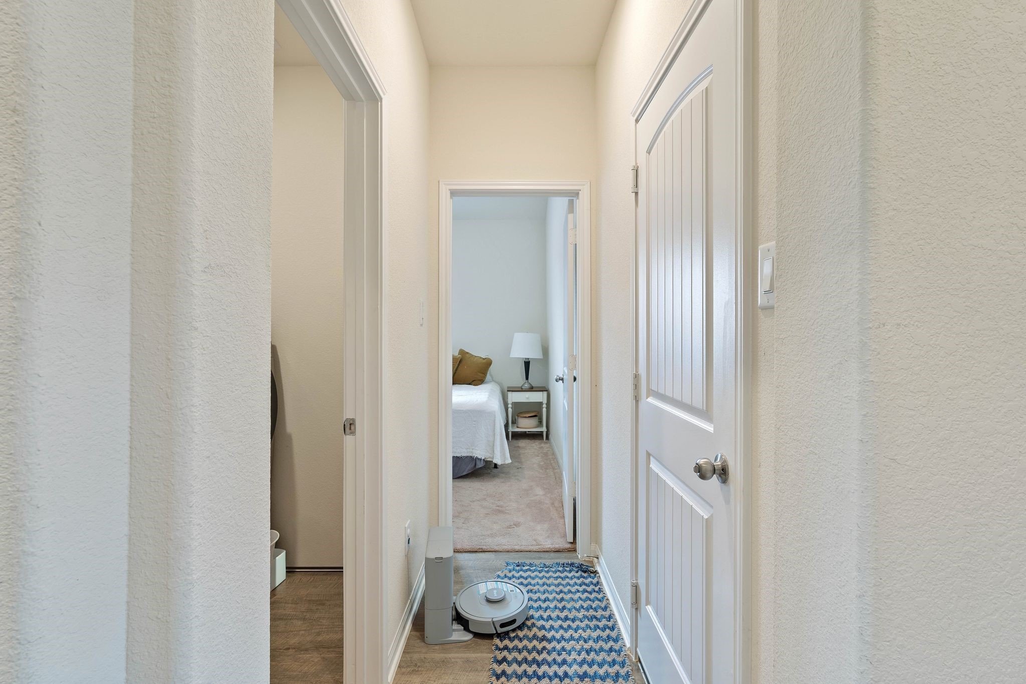 16450 Stonewall Street Conroe, TX 77303 - Photo 26 of 43 Hallway view leading to bedrooms and secondary bath.
