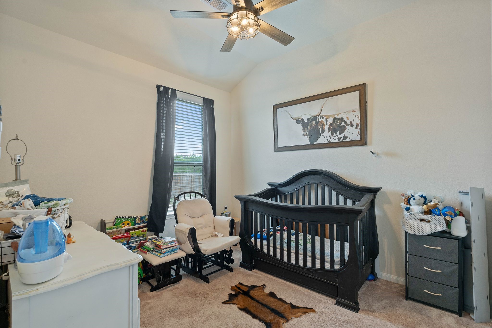 16450 Stonewall Street Conroe, TX 77303 - Photo 28 of 43 Nursery or flex room option featuring ceiling fan and cozy layout.