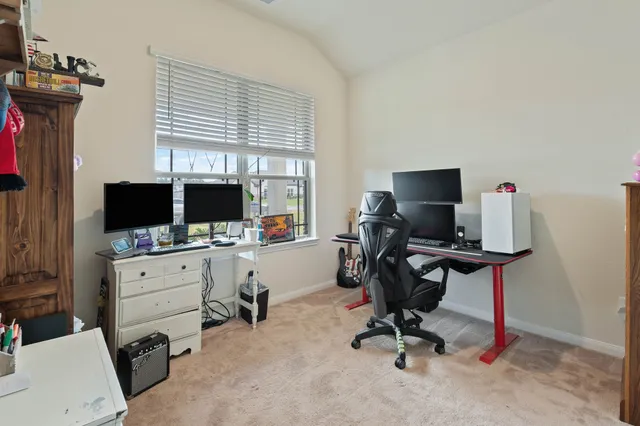 a bedroom with furniture and a window