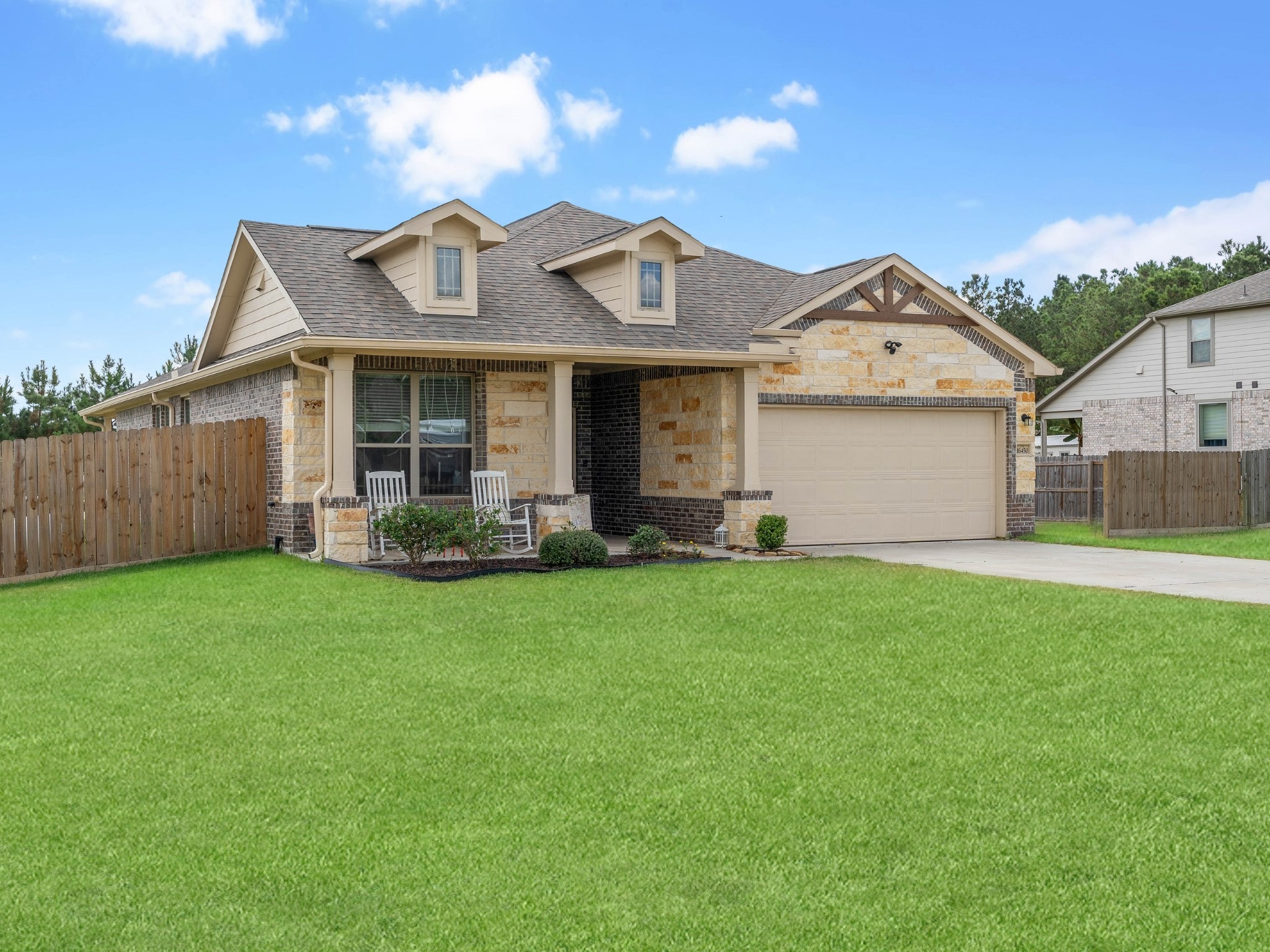 16450 Stonewall Street Conroe, TX 77303 - Photo 30 of 43 Alternate front angle showing full driveway and covered entry.