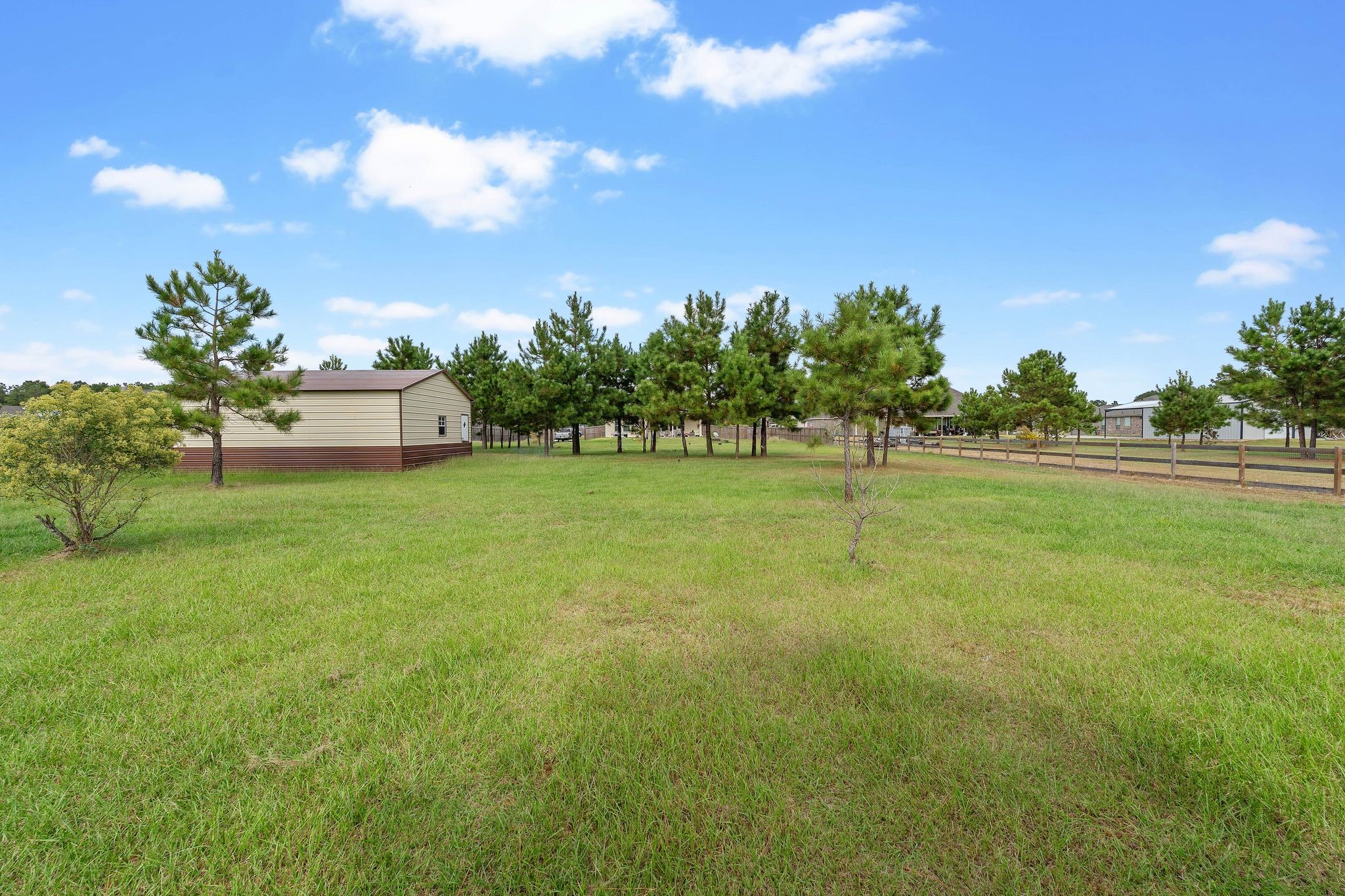 16450 Stonewall Street Conroe, TX 77303 - Photo 36 of 43 Alternate backyard view highlighting open lot and privacy.
