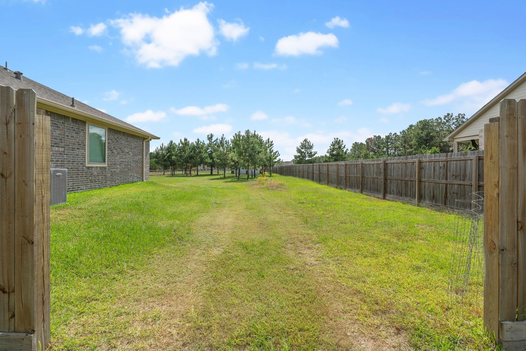 16450 Stonewall Street Conroe, TX 77303 - Photo 37 of 43 Side access view leading to backyard area.
