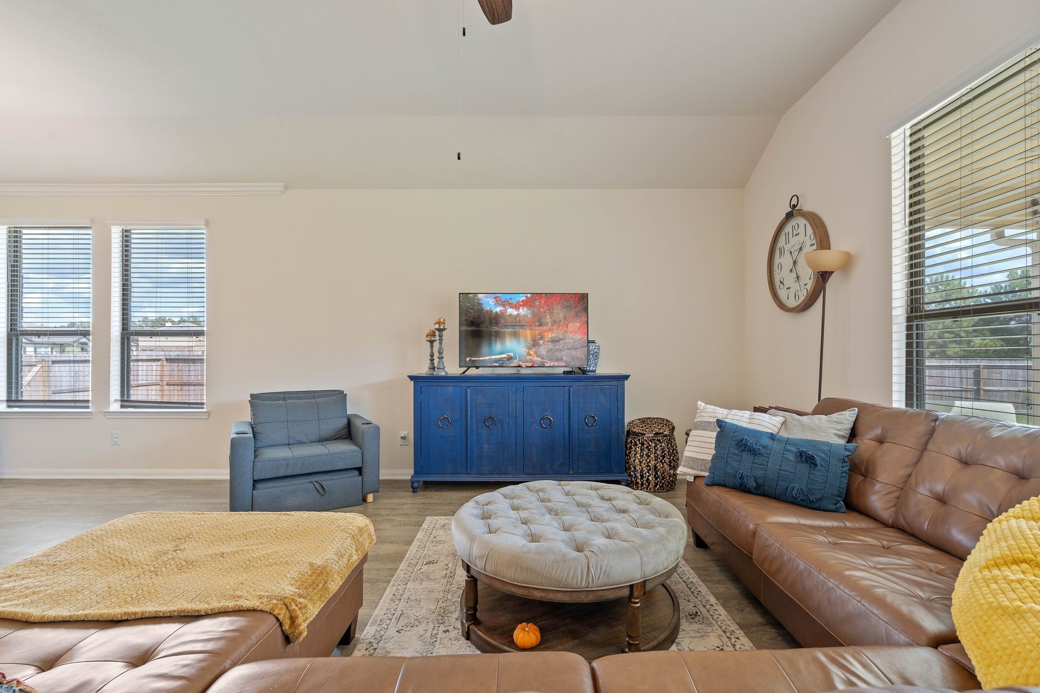 16450 Stonewall Street Conroe, TX 77303 - Photo 6 of 43 Cozy seating area with neutral tones and bright windows offering backyard views.