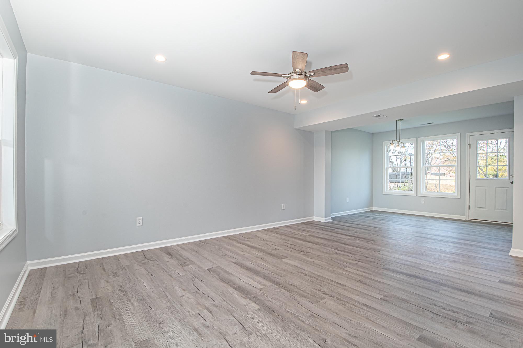 709 Ross Street Winchester, VA 22601 - Photo 4 of 40 wooden floor in an empty room with a window