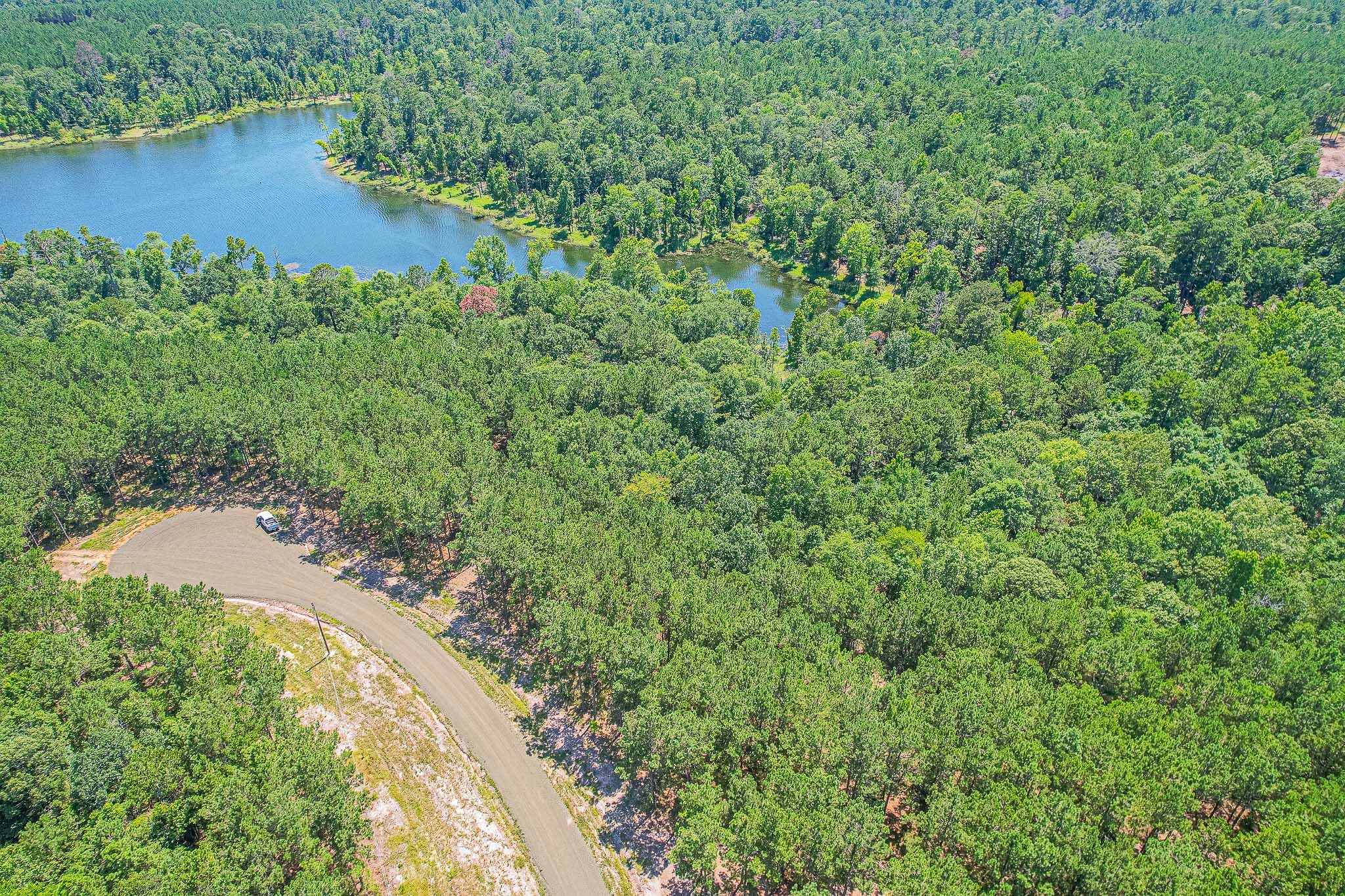 60 Fm 705 Broaddus, TX 75929 - Photo 6 of 11 an aerial view of a house with a yard and lake view