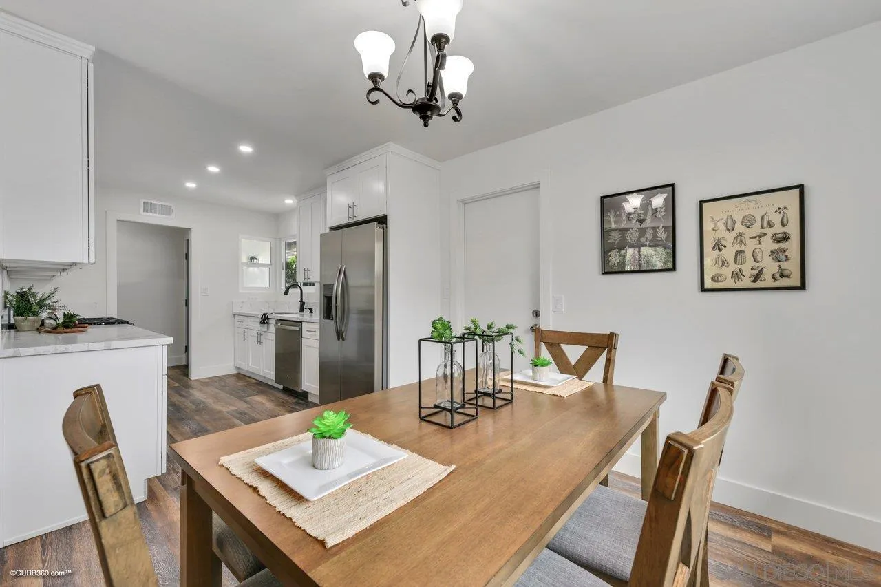 13331 Tobiasson Road Poway, CA 92064 - Photo 11 of 24 a view of a dining room with furniture and wooden floor