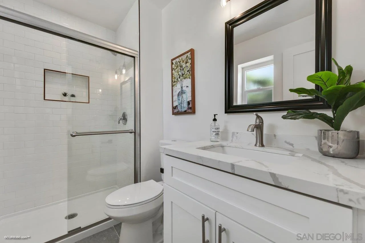 13331 Tobiasson Road Poway, CA 92064 - Photo 12 of 24 a bathroom with a granite countertop sink toilet and shower