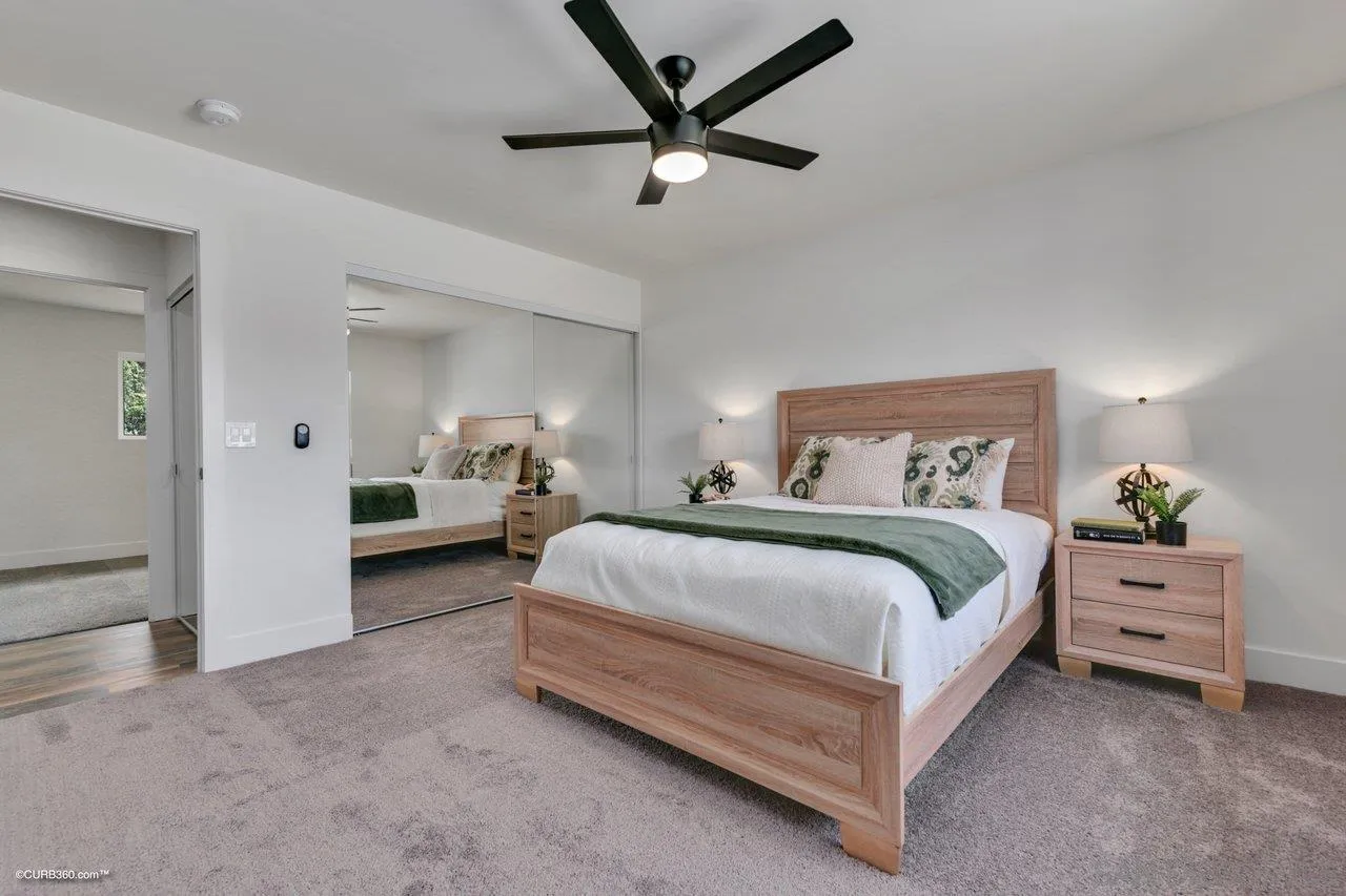 13331 Tobiasson Road Poway, CA 92064 - Photo 13 of 24 a spacious bedroom with a bed and a chandelier