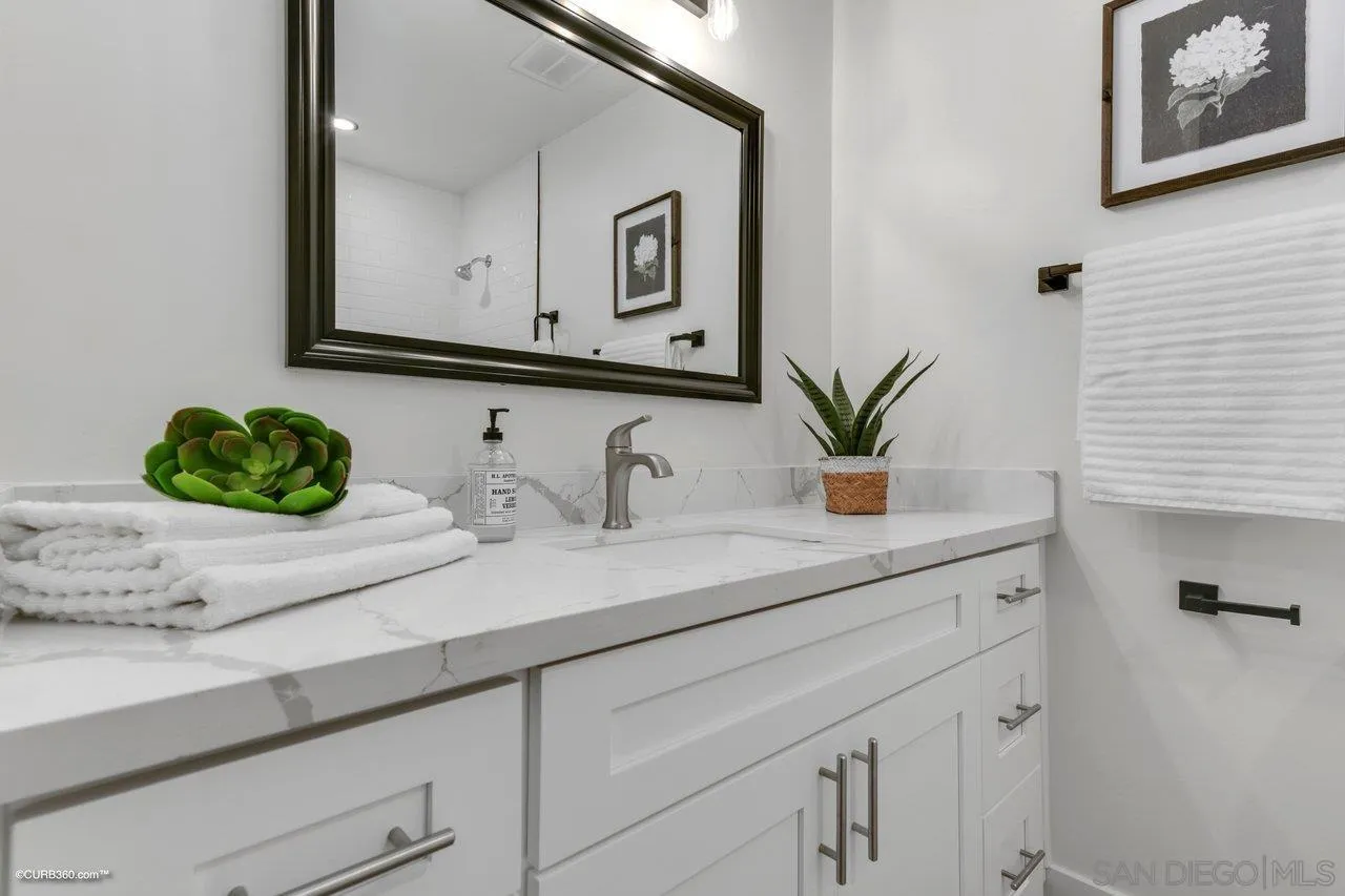 13331 Tobiasson Road Poway, CA 92064 - Photo 18 of 24 a bathroom with a sink and a mirror