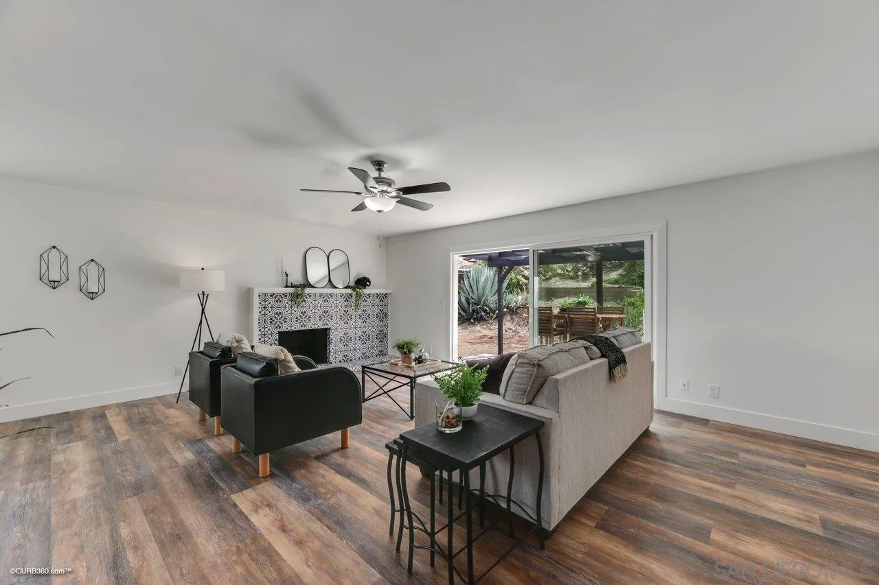 13331 Tobiasson Road Poway, CA 92064 - Photo 4 of 24 a living room with furniture and a chandelier