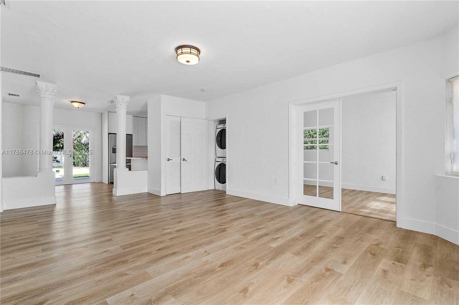8934 Harding Avenue Surfside, FL 33154 - Photo 13 of 52 a view of empty room with wooden floor