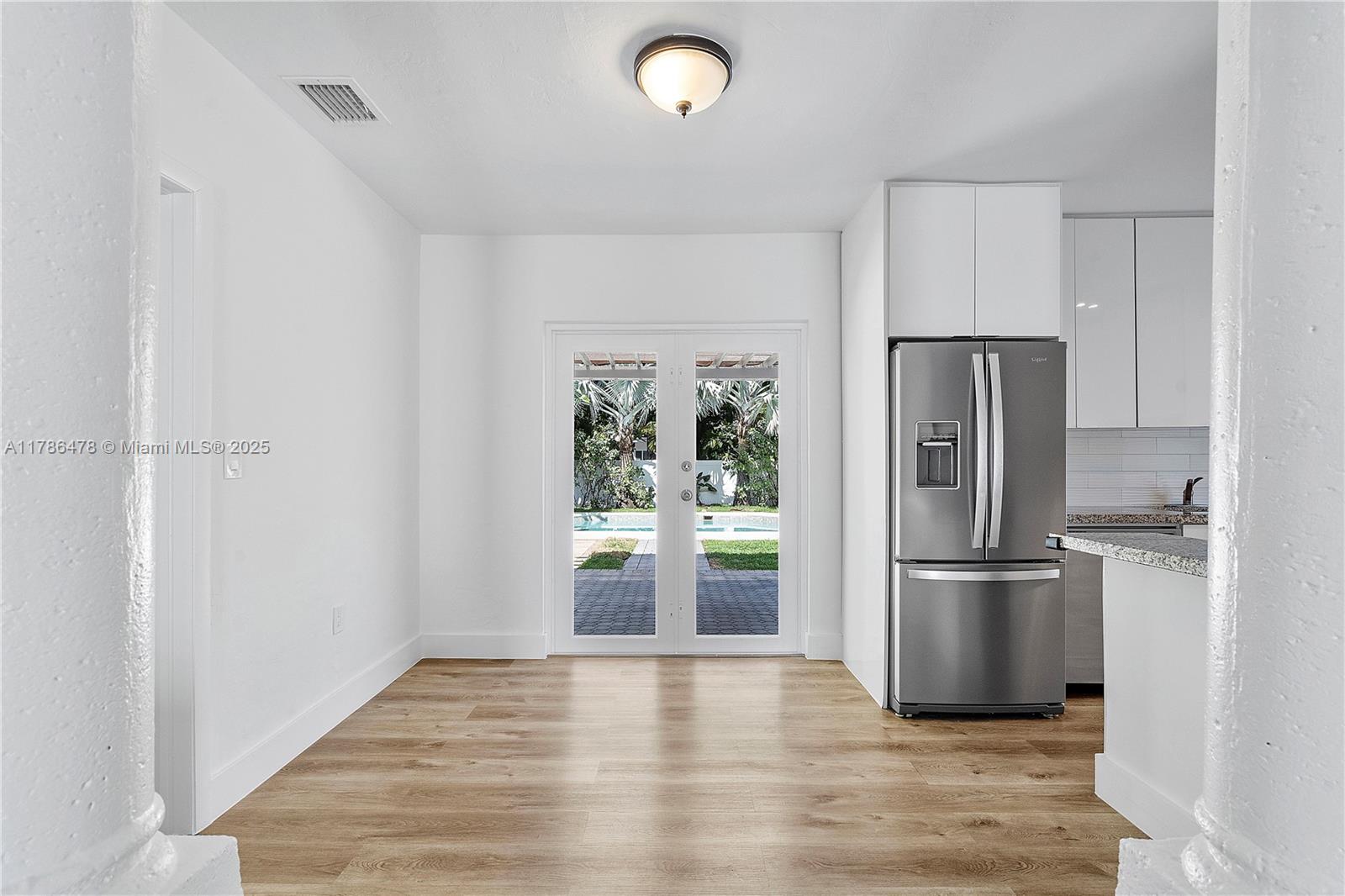 8934 Harding Avenue Surfside, FL 33154 - Photo 17 of 52 a kitchen with a refrigerator and a sink