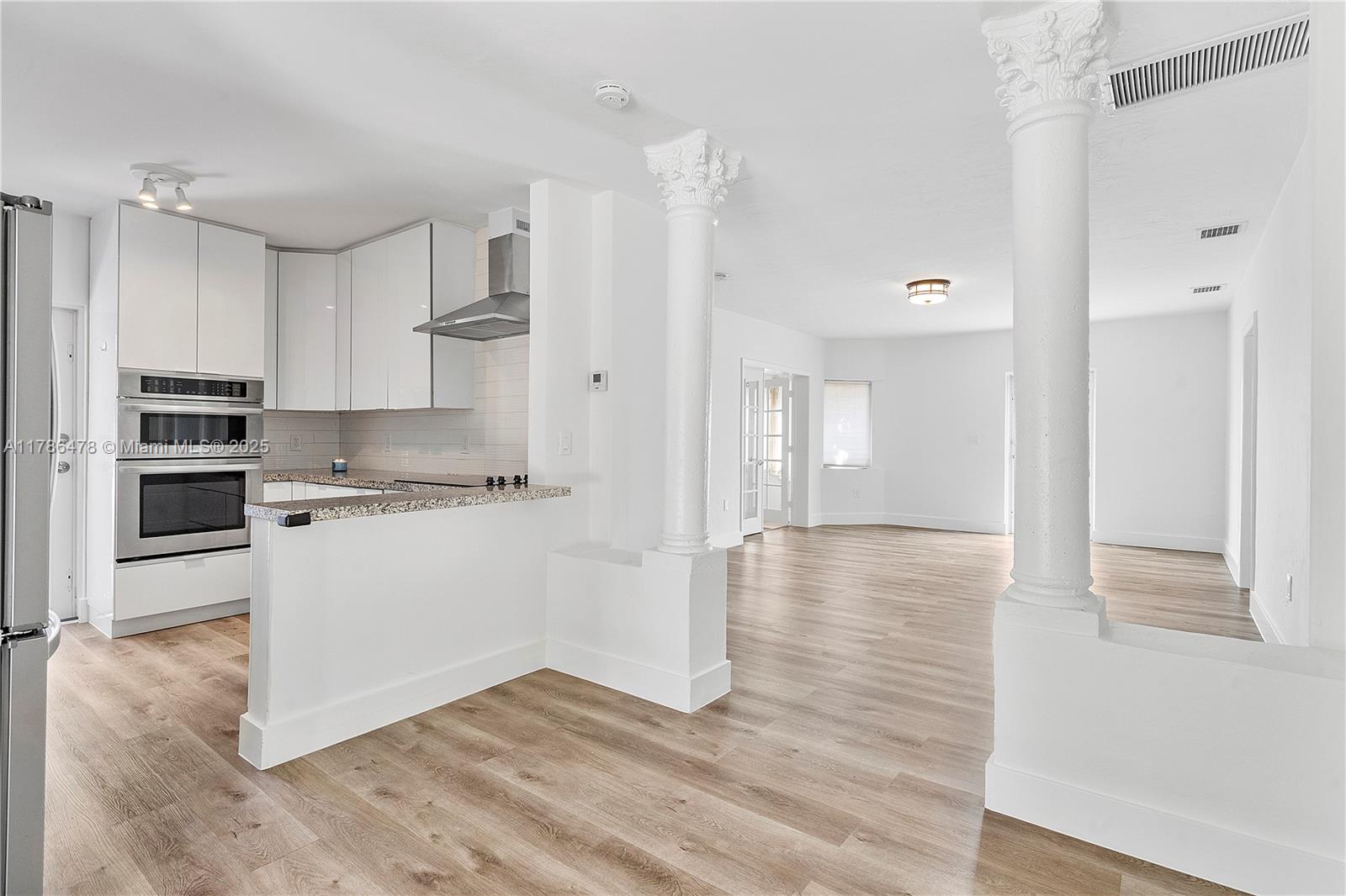 8934 Harding Avenue Surfside, FL 33154 - Photo 19 of 52 a view of kitchen with wooden floor