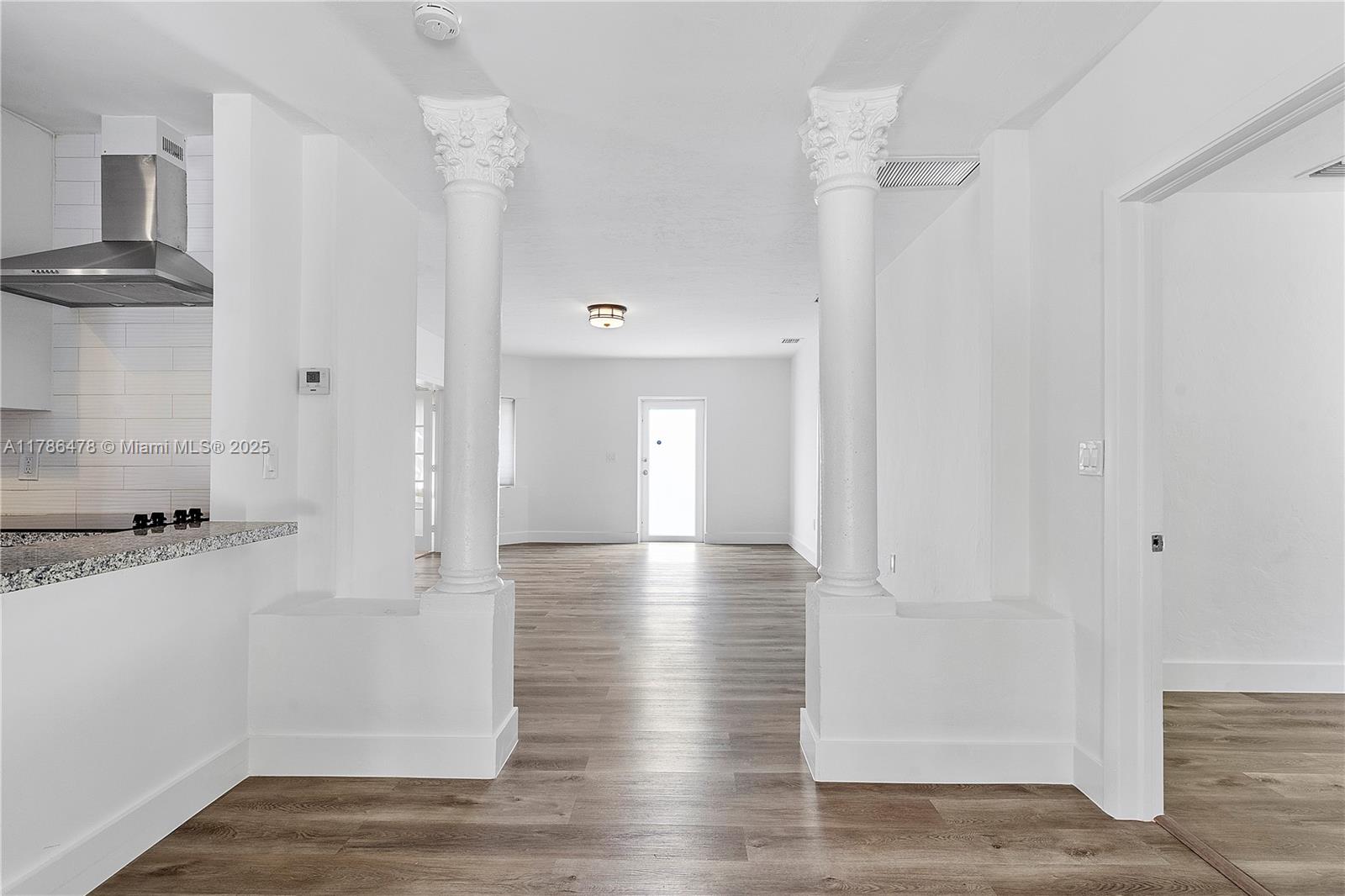 8934 Harding Avenue Surfside, FL 33154 - Photo 20 of 52 a view of empty room with wooden floor