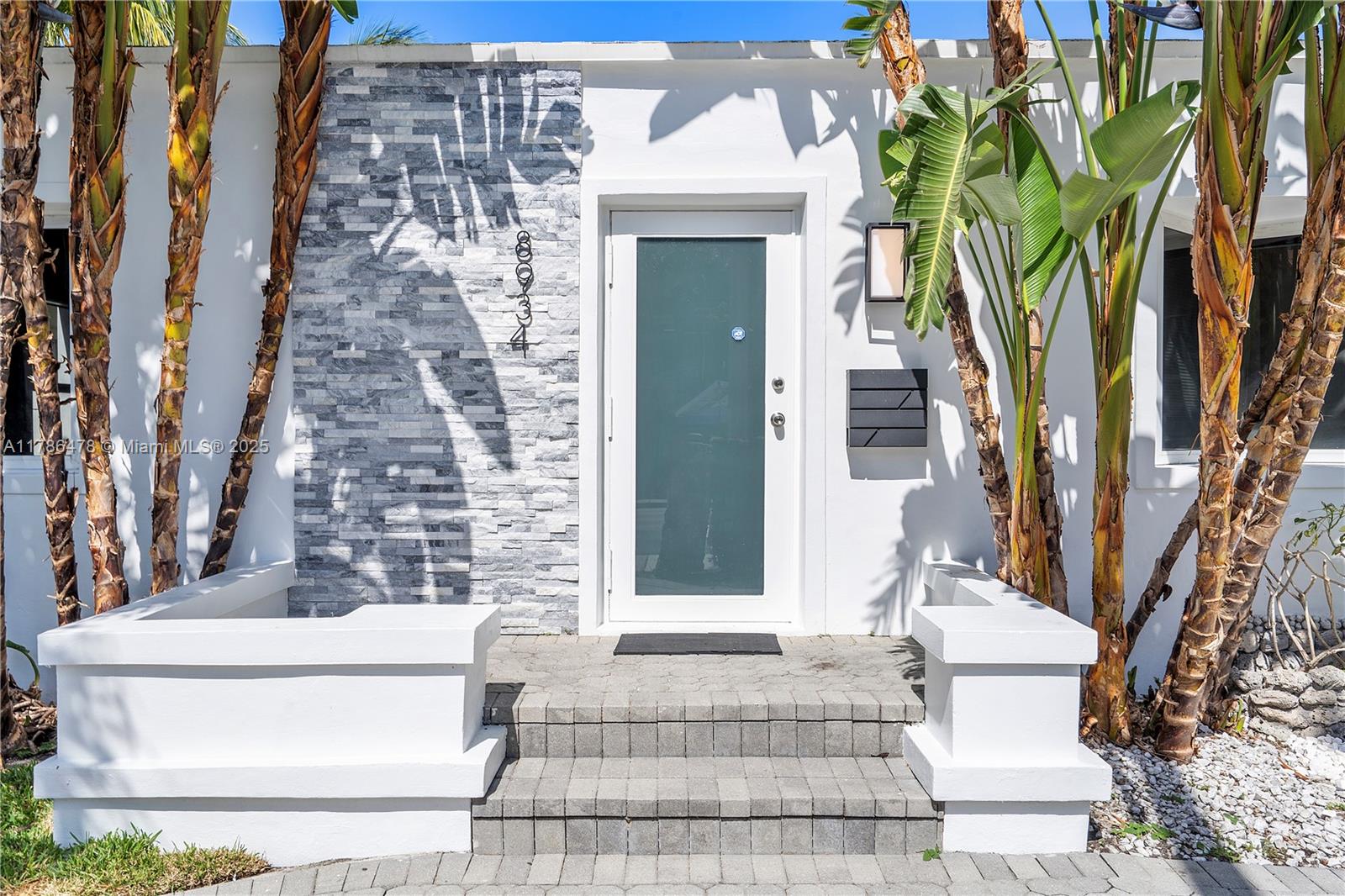 8934 Harding Avenue Surfside, FL 33154 - Photo 3 of 52 a front view of a house