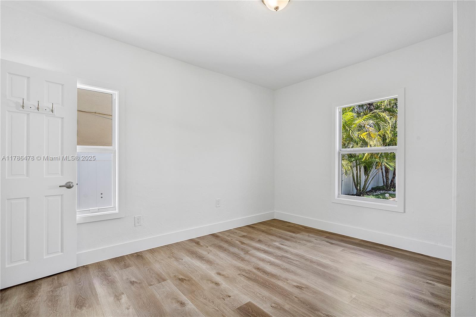 8934 Harding Avenue Surfside, FL 33154 - Photo 32 of 52 wooden floor in an empty room