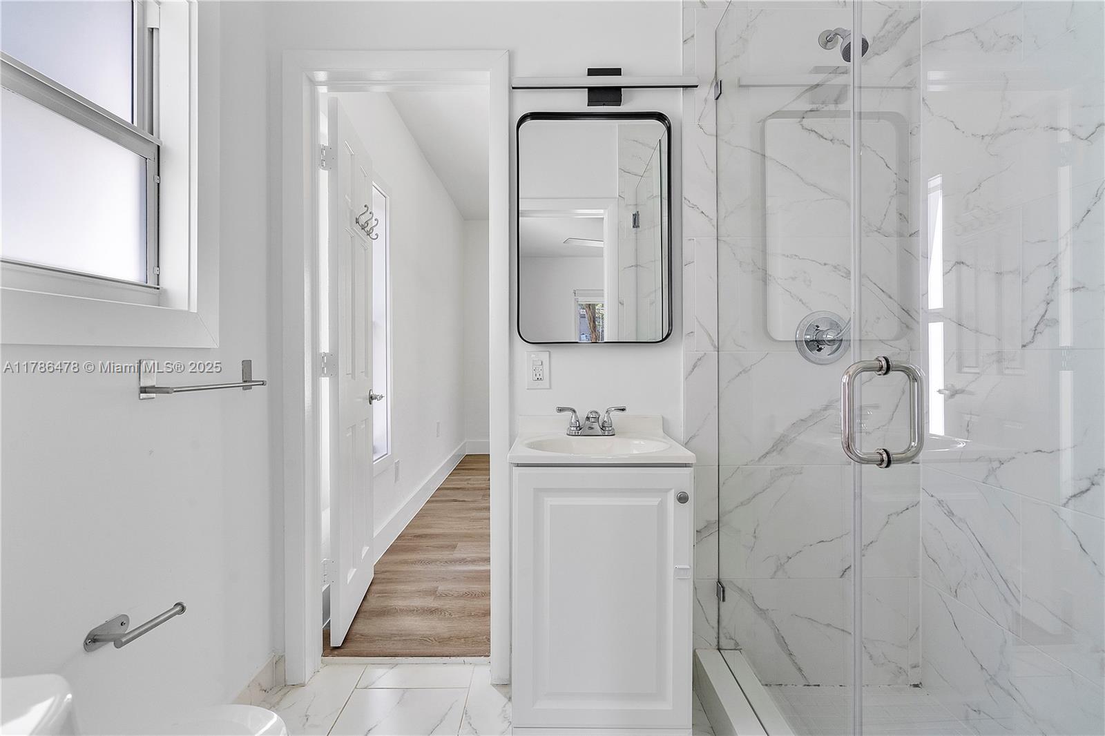 8934 Harding Avenue Surfside, FL 33154 - Photo 34 of 52 a bathroom with a shower