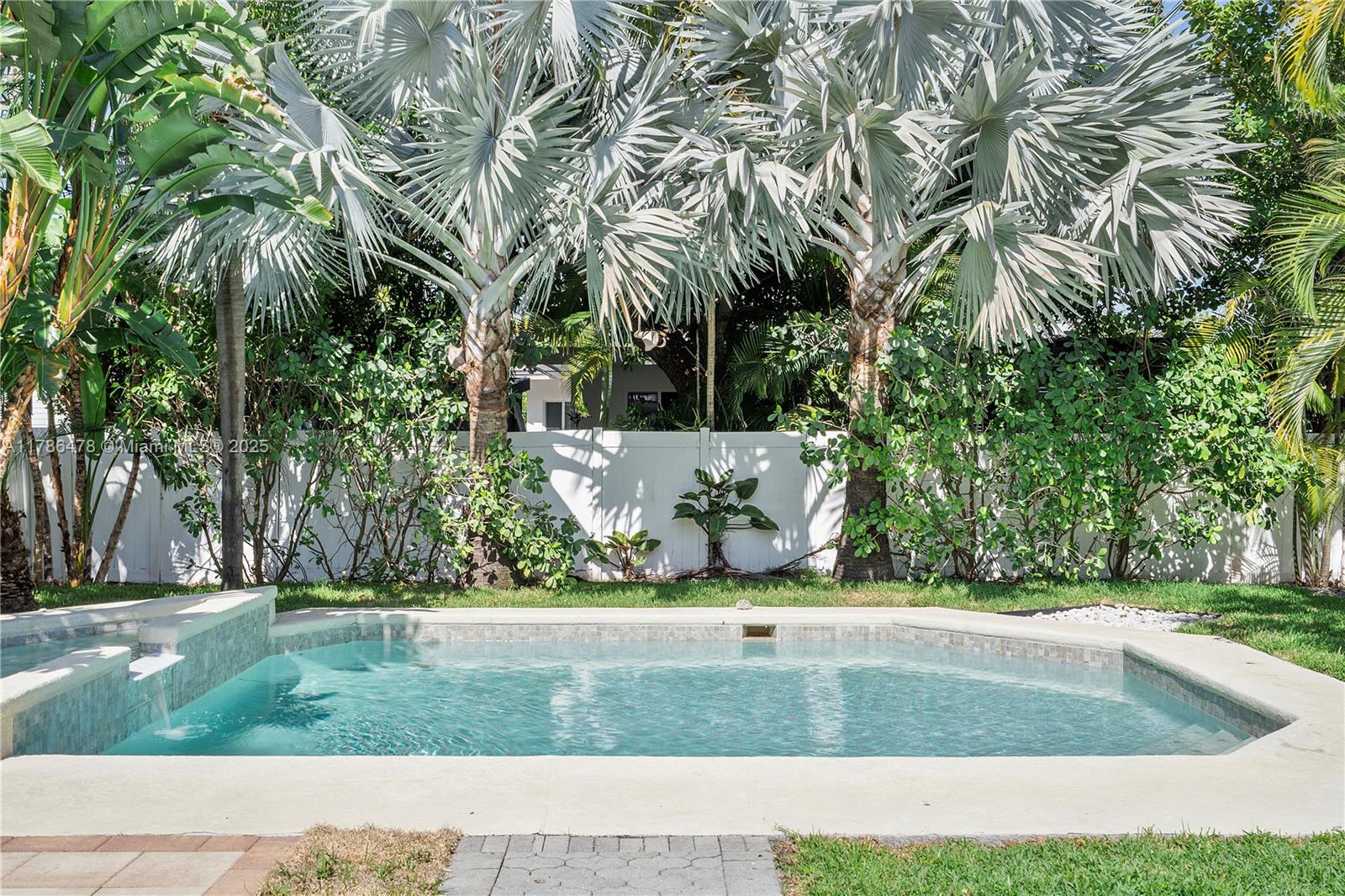 8934 Harding Avenue Surfside, FL 33154 - Photo 36 of 52 a view of a yard with palm trees