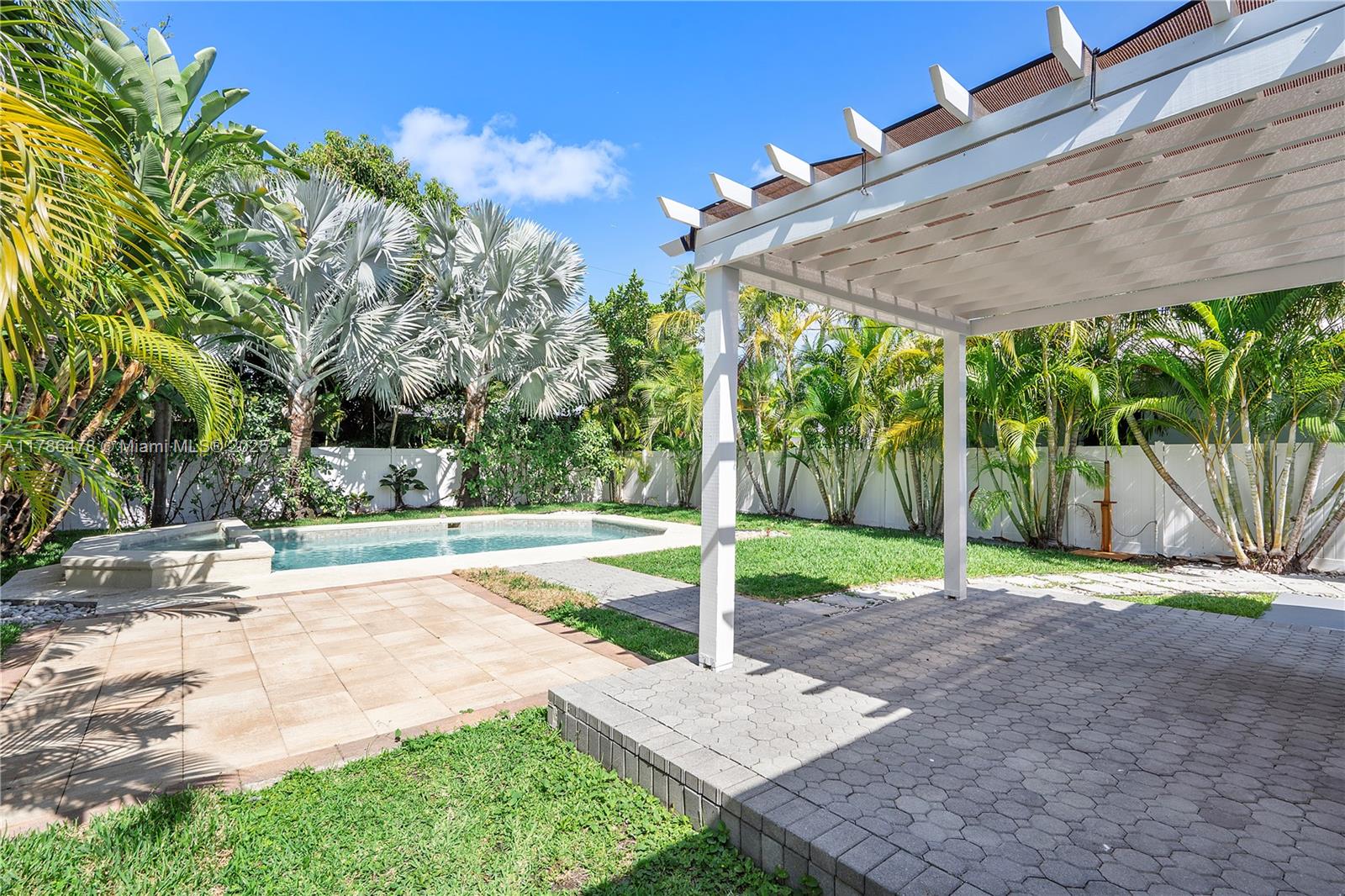 8934 Harding Avenue Surfside, FL 33154 - Photo 37 of 52 a view of a backyard with tree