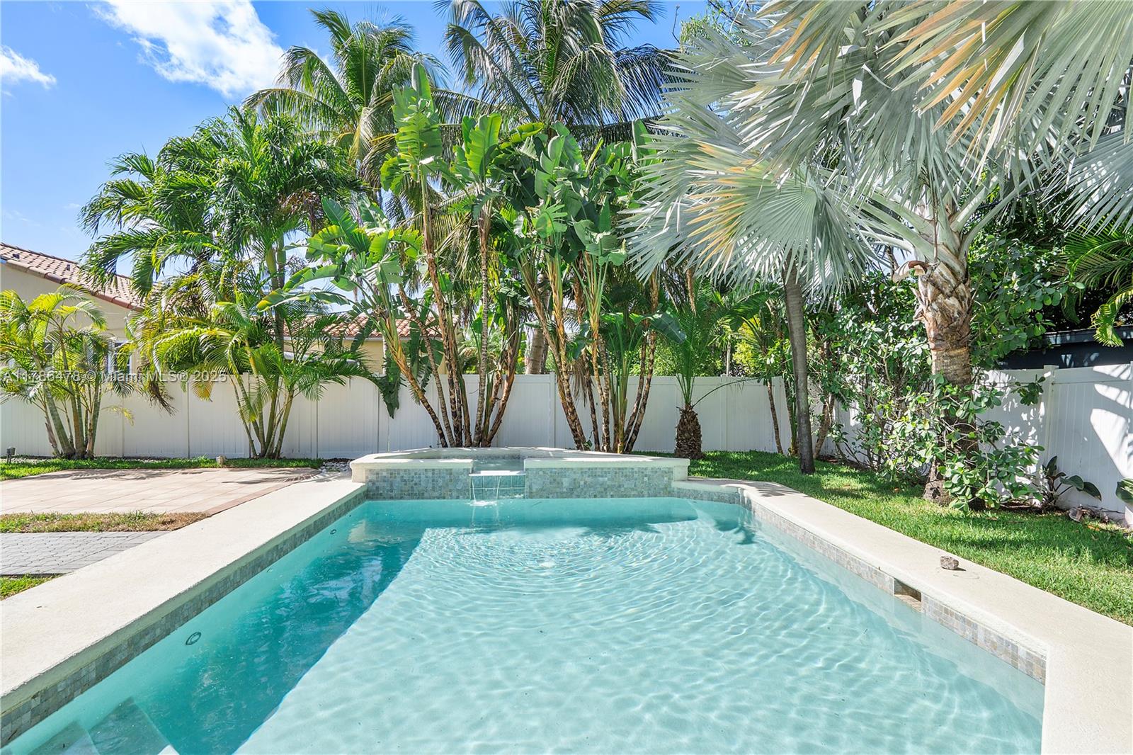 8934 Harding Avenue Surfside, FL 33154 - Photo 38 of 52 a view of a yard with plants and trees