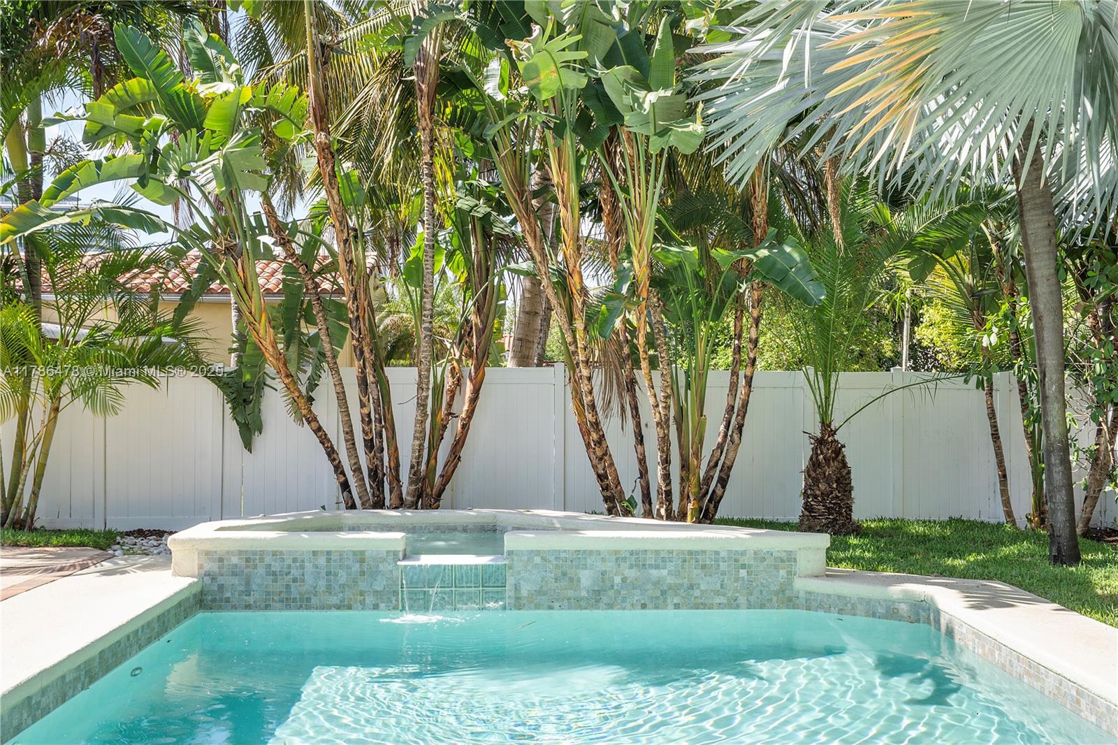 8934 Harding Avenue Surfside, FL 33154 - Photo 39 of 52 a view of a yard with a tree