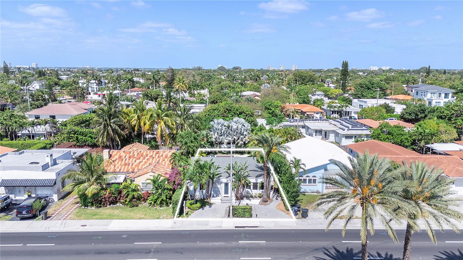 8934 Harding Avenue Surfside, FL 33154 - Photo 49 of 52 an aerial view of residential houses with outdoor space and trees