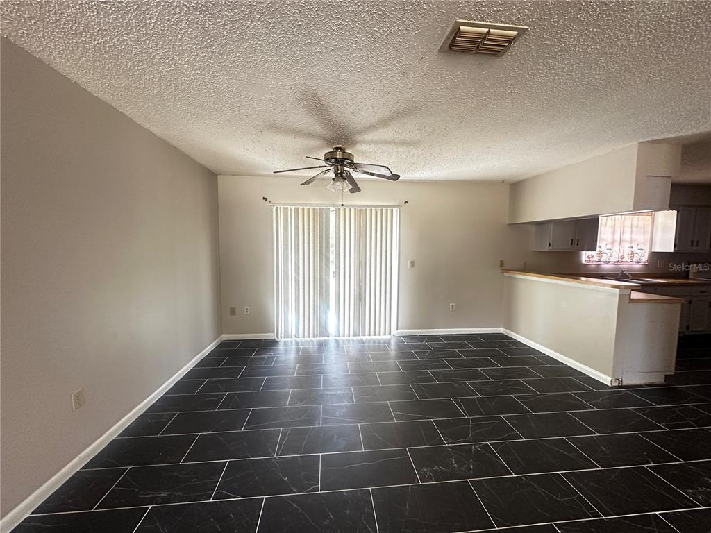 66 Silver Lane Ocala, FL 34472 - Photo 5 of 10 a view of a kitchen with a sink cabinets and stainless steel appliances