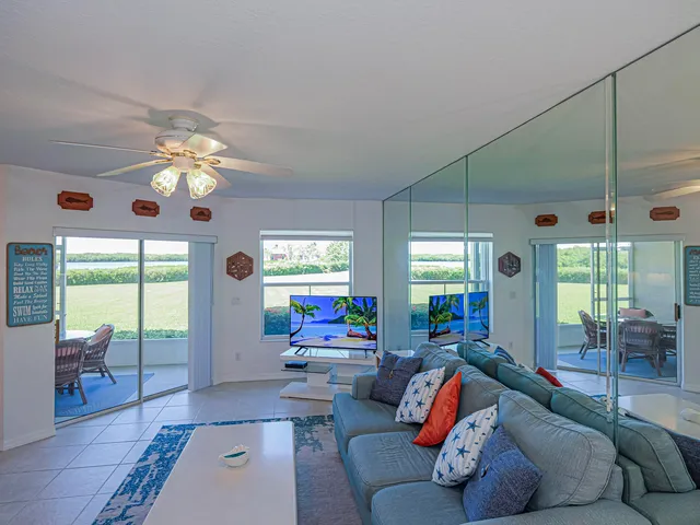 a kitchen with granite countertop cabinets stainless steel appliances and a window