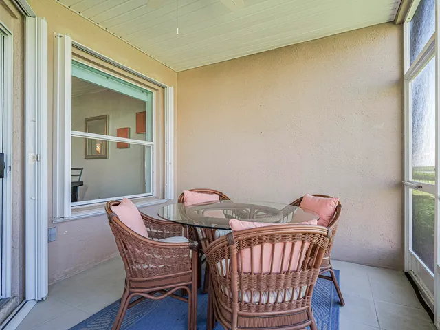 a kitchen with white cabinets appliances and sink