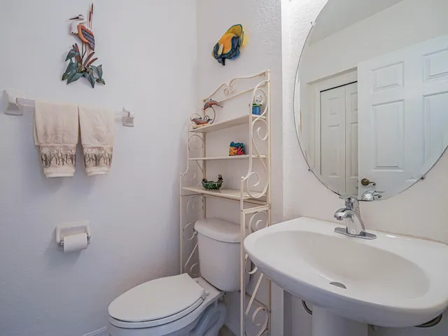 a bedroom with a bed and a dresser in it