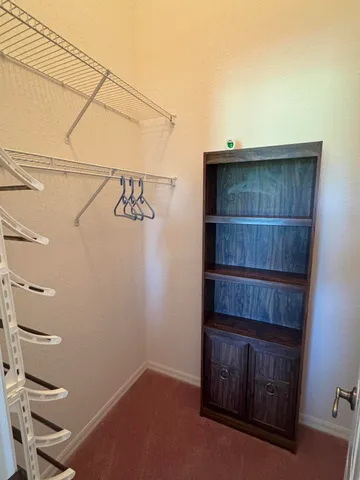 an aerial view of a house with outdoor space