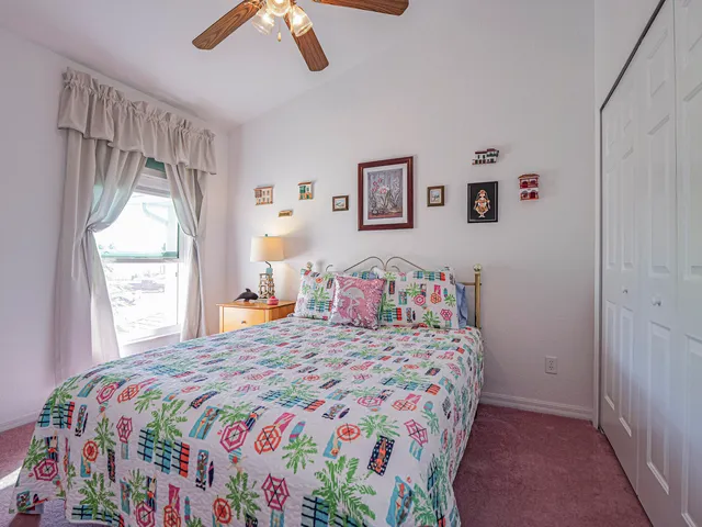 an aerial view of a residential houses with outdoor space and seating