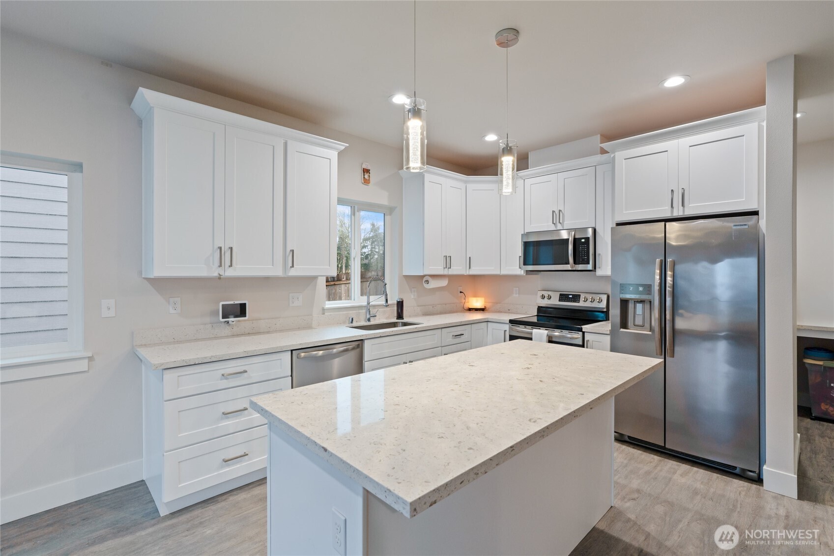 138 Blackfish Court Bremerton, WA 98310 - Photo 12 of 36 a kitchen with white cabinets and stainless steel appliances