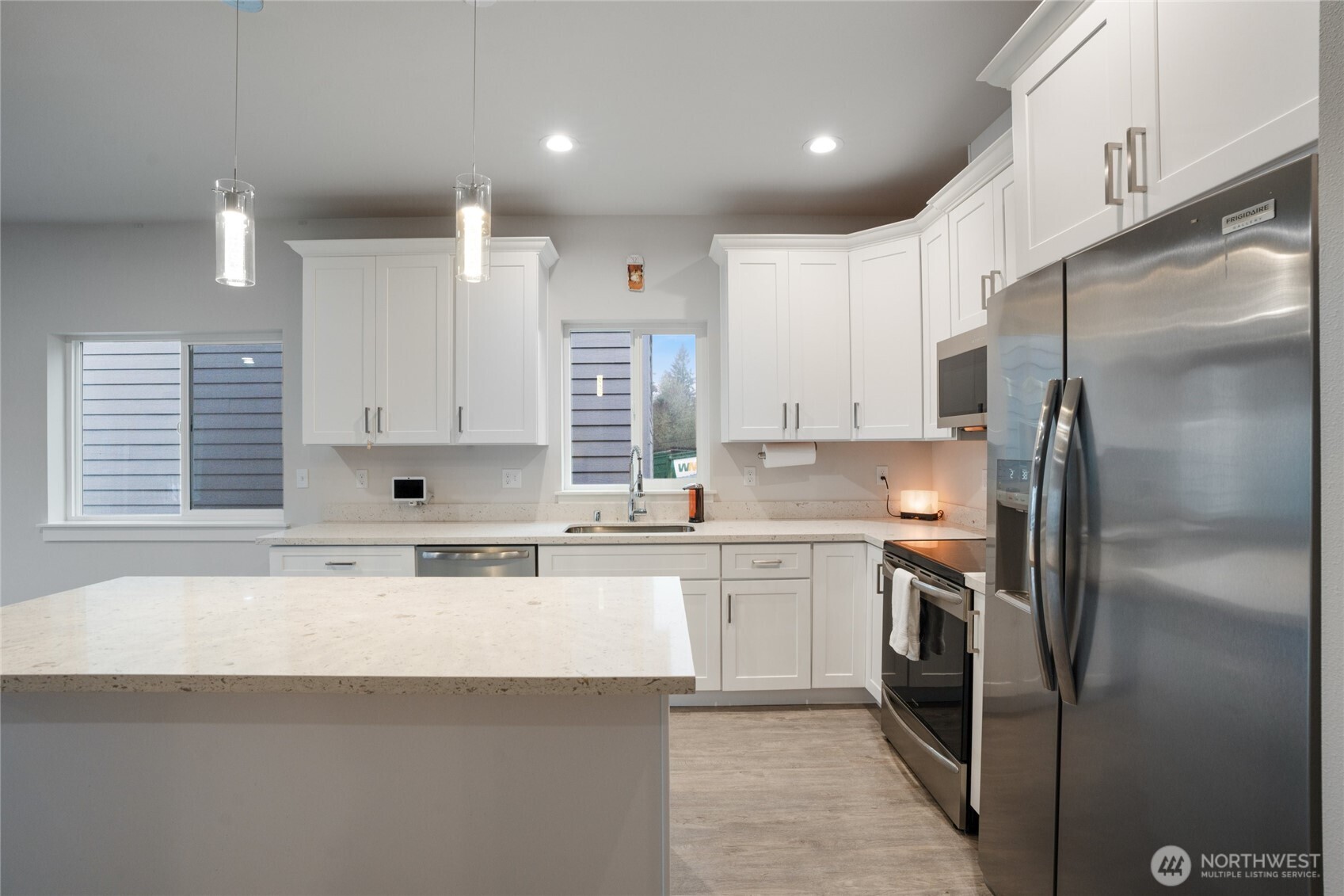 138 Blackfish Court Bremerton, WA 98310 - Photo 13 of 36 a kitchen with a sink stainless steel appliances and white cabinets