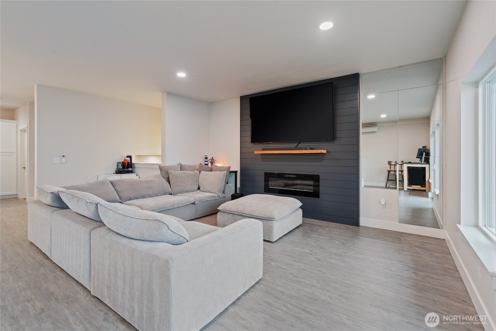 138 Blackfish Court Bremerton, WA 98310 - Photo 8 of 36 a living room with furniture a flat screen tv and a fireplace