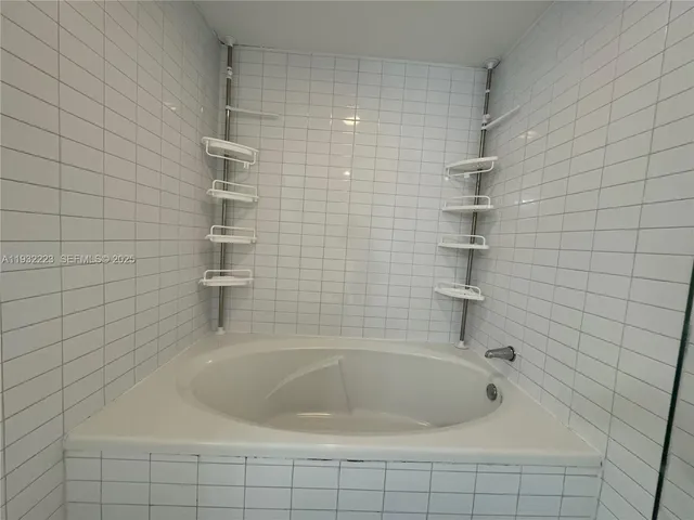 an empty room with wooden floor and closet