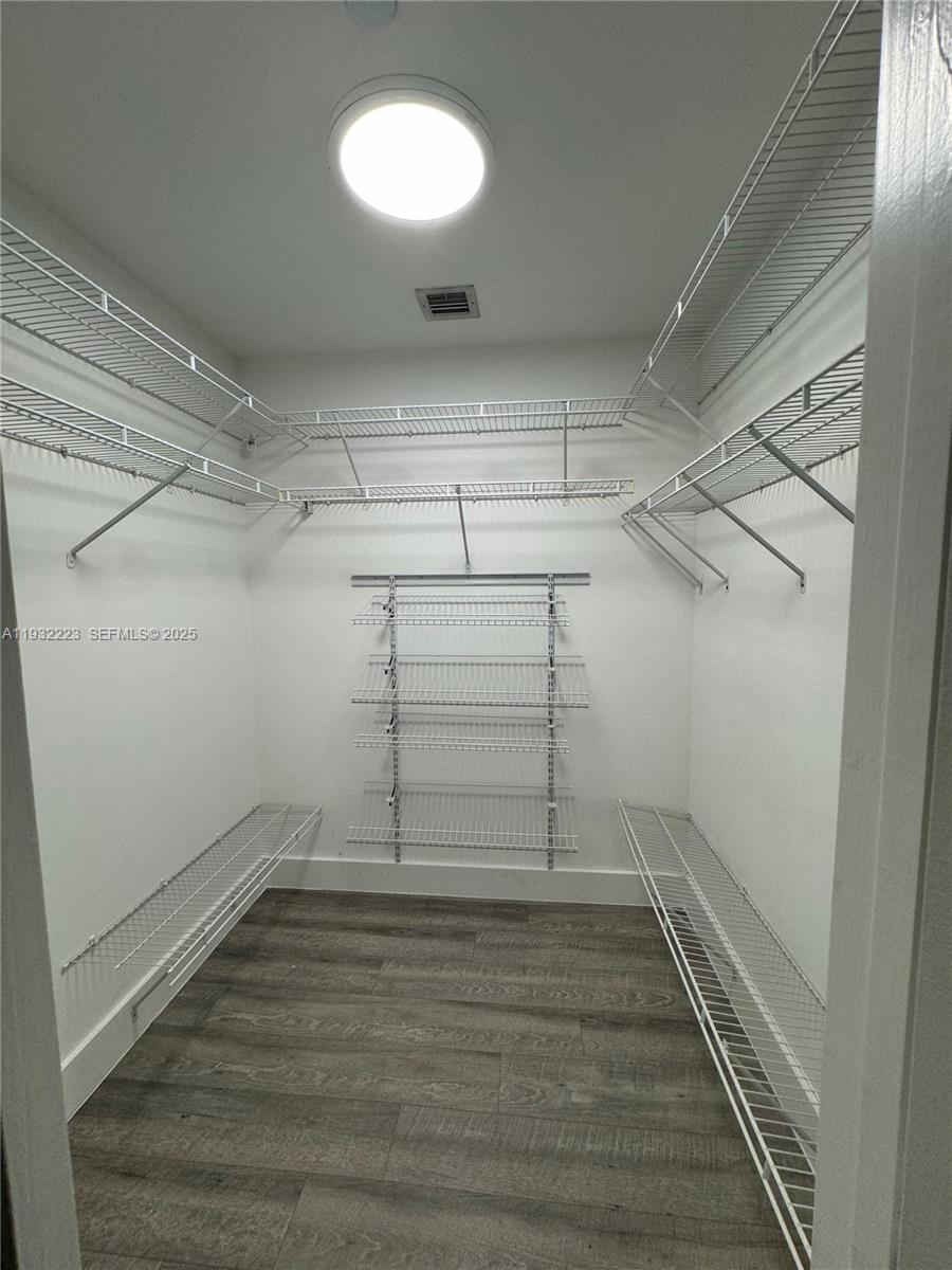 888 Biscayne Boulevard, Unit 709 Miami, FL 33132 - Photo 25 of 48 a view of a room with racks on the wall