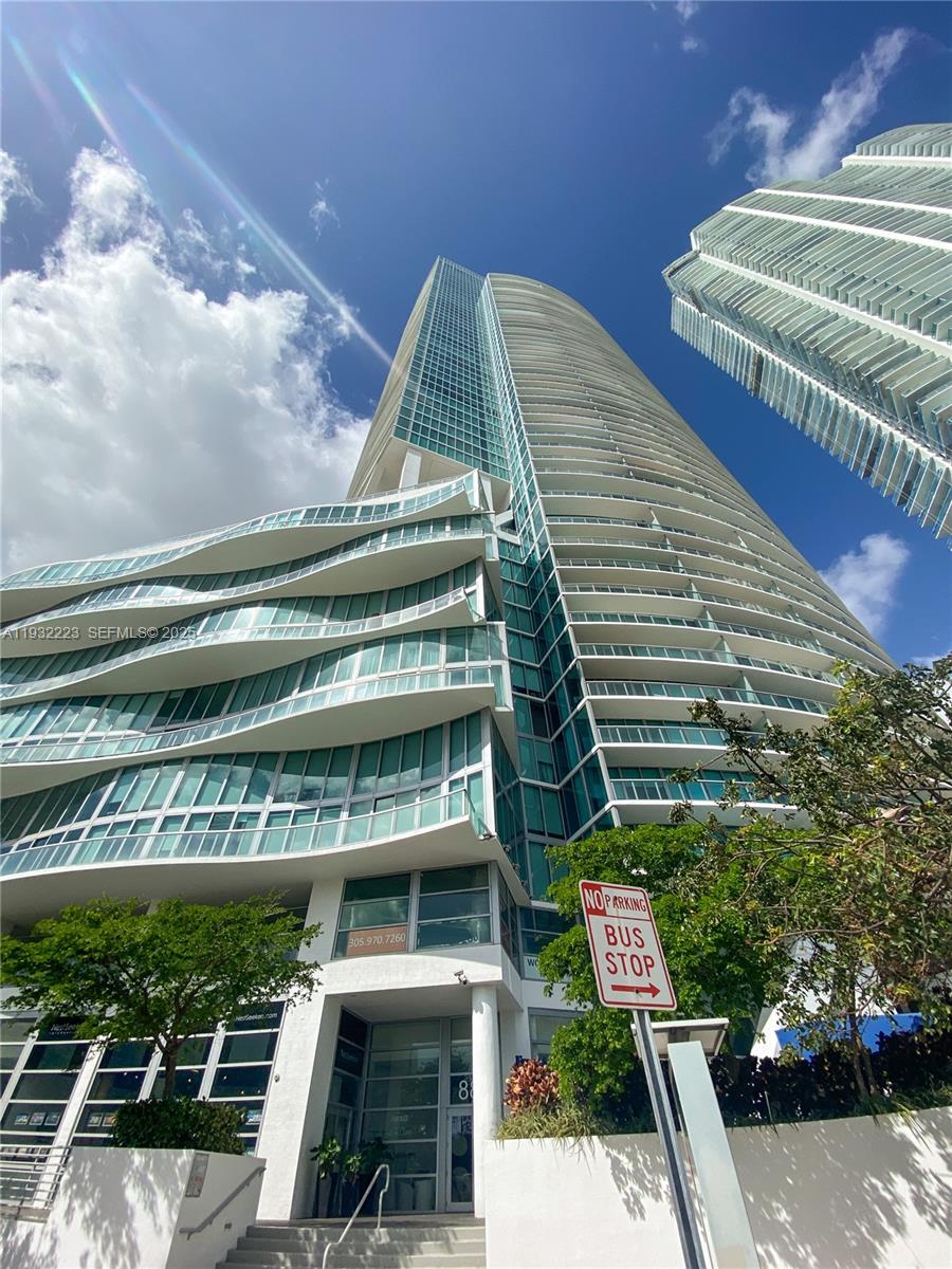888 Biscayne Boulevard, Unit 709 Miami, FL 33132 - Photo 34 of 48 a view of a tall building from a balcony