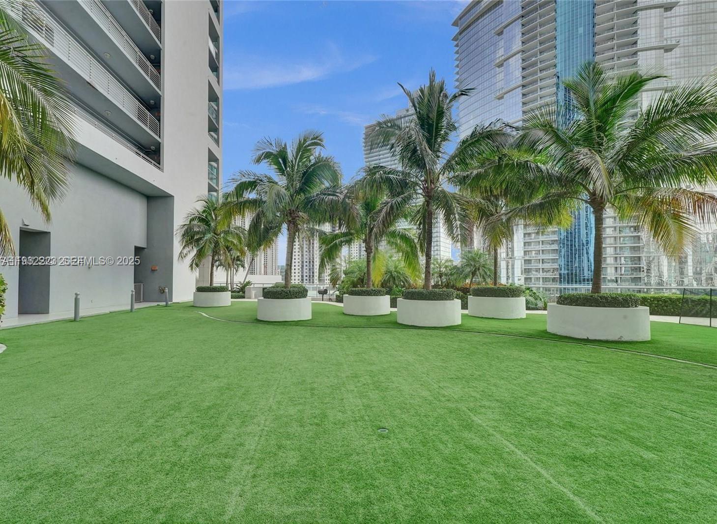 888 Biscayne Boulevard, Unit 709 Miami, FL 33132 - Photo 39 of 48 a view of a backyard with swimming pool