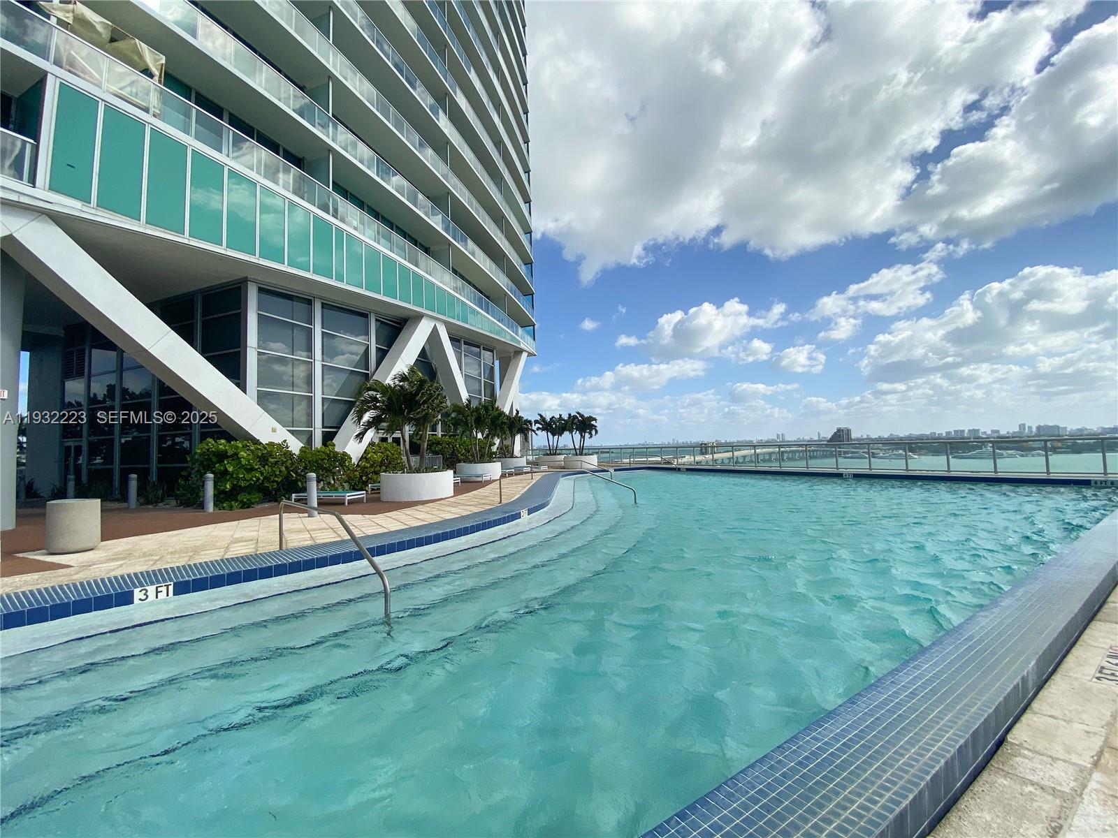 888 Biscayne Boulevard, Unit 709 Miami, FL 33132 - Photo 4 of 48 a view of outdoor space yard and swimming pool