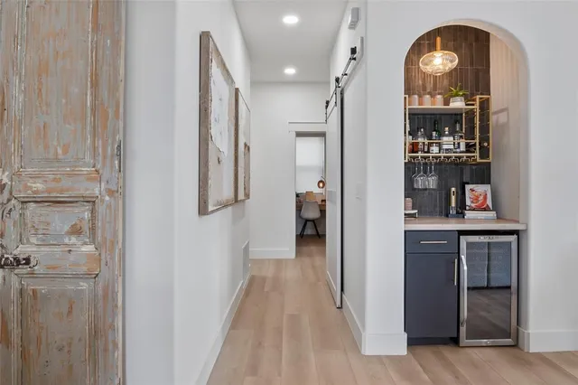a bedroom with bed and wooden floor