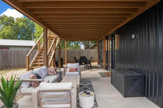 a outdoor dining space with furniture and outdoor view