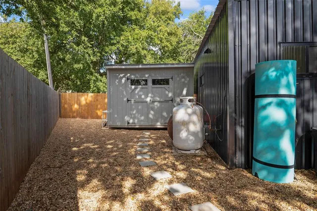 an aerial view of a houses with a lake view